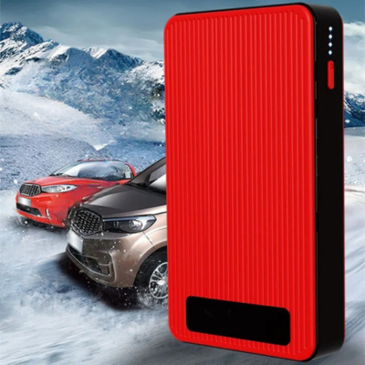 chargeur booster batterie derriere deux voiture terrain neigeu