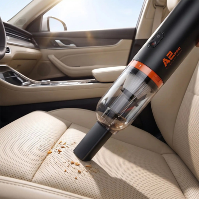 Aspirateur voiture puissant aspirant un coussin beige