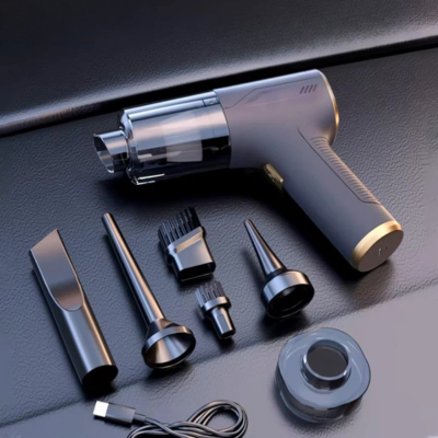 aspirateur de voiture pose avec accessoire sur fond noir