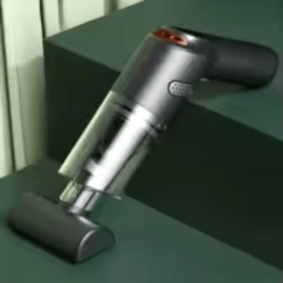 Aspirateur de voiture sans fil 15 000 Pa avec brosse posé sur un fond vert