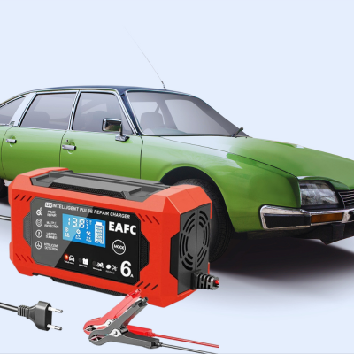 chargeur de batterie voiture a cote d une voiture citroen