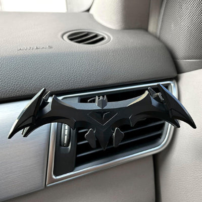 support de telephone pour voiture sous forme de batman pose sur bouche d aeration 